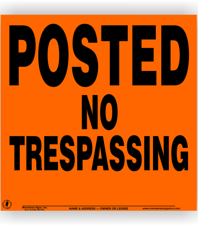 orange posted no trespassing sign metal