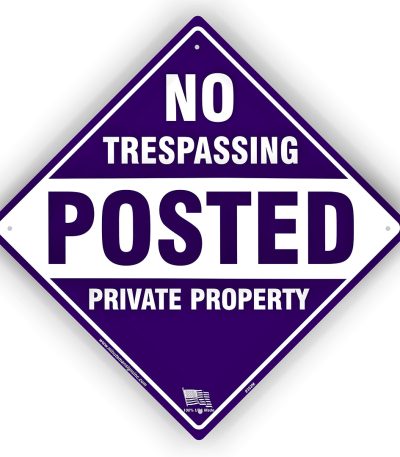 purple posted no trespassing sign